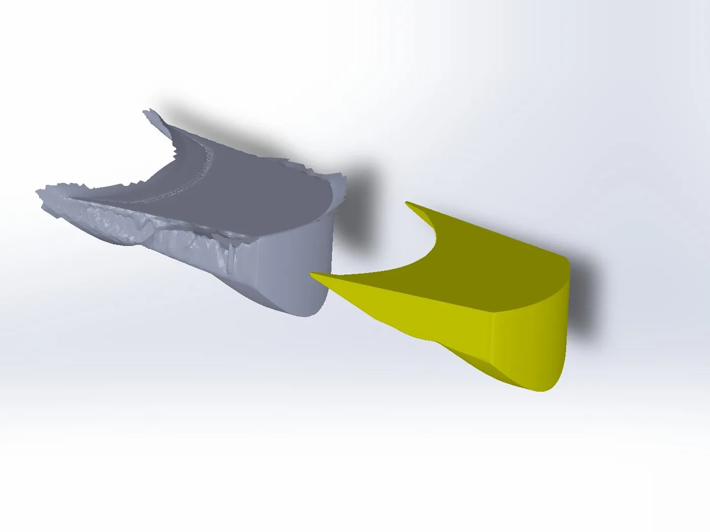 Rétro-ingénierie d'une pièce mécanique : maillage brut de numérisation 3D à gauche, modèle STEP surfacique reconstruit à droite
